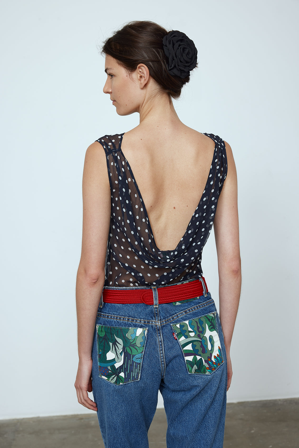 Alexa Top in Black Polka Dot Transparent Silk Chiffon. The top features a straight neckline and a deep plunging back. Material: 100% mulberry silk.