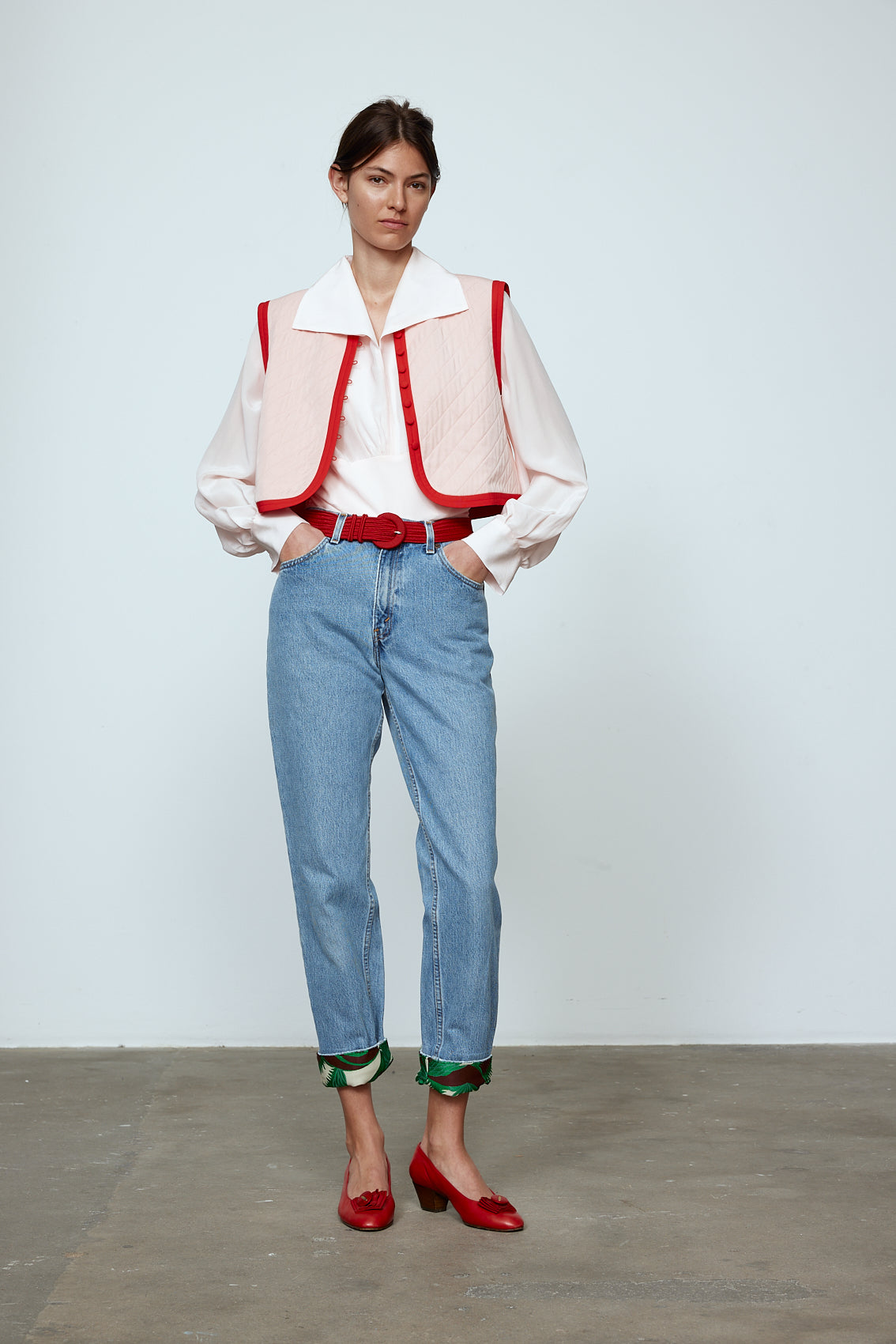 The Ravnbak Vest in Baby Pink with a red lining. Style it over a shirt, dress or top. Also available in Beaded Olive Green. Material: 70% viscose, 30% tencel. Lining: 100% viscose.