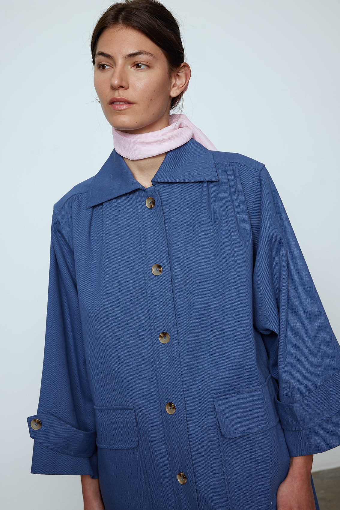 The Anna Coat in French Blue Canvas. The jacket is inspired by vintage work-wear with wide sleeves, cuffs, and button closing on the front. Material: 100% cotton.