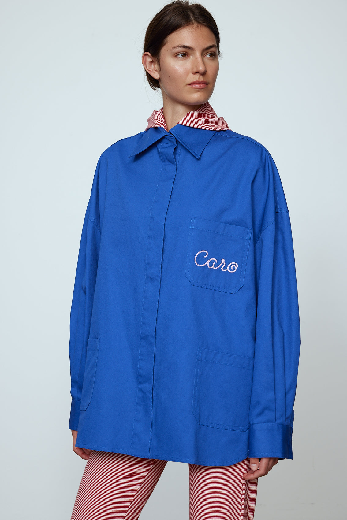 The Frederik Shirt is an oversized cotton style with big sleeves and an embroidered Caro logo on the front. Style it open over a dress, tank top, or t-shirt or buttoned up on its own. Material: 100% cotton. The model is 179cm (5'10") and wears size S. Inspired by Frederik Bille Brahe.