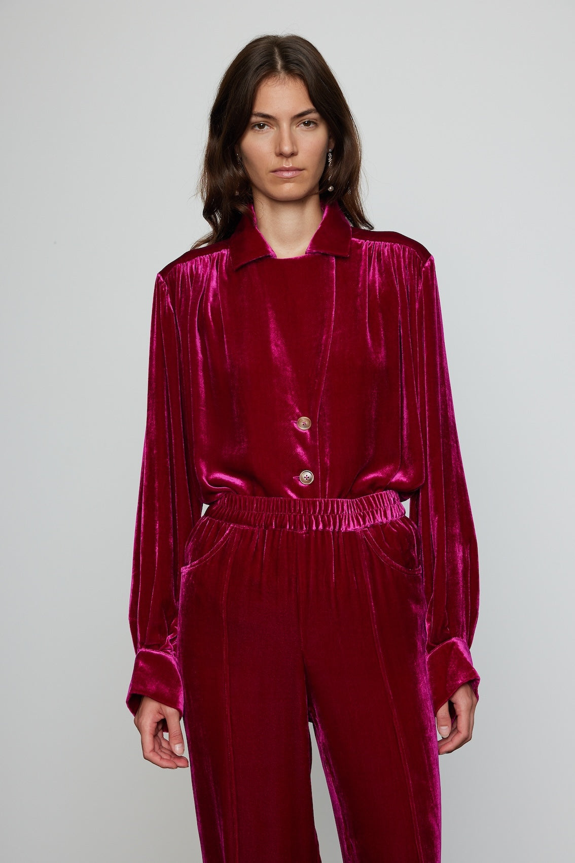 Caro Editions Bonsai Shirt is made in a luxurious silk velvet fabric with a heavy fall. The Shirt features long draped sleeves, a deep-cut oversized shirt collar, and buttons on the front. Style it with jeans and a colorful belt, or match it with matching Bonsai Pants in Silk Velvet for parties, dinners, and special occasions. Material: 80% Viscose, 20% Silk.
