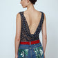 Alexa Top in Black Polka Dot Transparent Silk Chiffon. The top features a straight neckline and a deep plunging back.   Material: 100% mulberry silk.