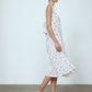 The Sonya Dress is an oversized style with a high neckline and low back featuring a large bow detail. The dress is made from soft mulberry silk featuring a White Daisy print. Style it with an open shirt or denim jacket.  Also available in Beaded Emerald Silk Velvet, Navy Flower Poplin, and Black Silk Velvet.  Material: 100% cotton.