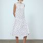 The Sonya Dress is an oversized style with a high neckline and low back featuring a large bow detail. The dress is made from soft mulberry silk featuring a White Daisy print. Style it with an open shirt or denim jacket.  Also available in Beaded Emerald Silk Velvet, Navy Flower Poplin, and Black Silk Velvet.  Material: 100% cotton.