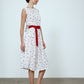 The Sonya Dress is an oversized style with a high neckline and low back featuring a large bow detail. The dress is made from soft mulberry silk featuring a White Daisy print. Style it with an open shirt or denim jacket.  Also available in Beaded Emerald Silk Velvet, Navy Flower Poplin, and Black Silk Velvet.  Material: 100% cotton.
