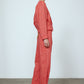 The Emma Pants in Orange Linen. The pants feature cargo details on the side and large pockets with piping details in a contrasting color. Easily modify the shape of the pants with a button adjustment.  Style them with a t-shirt, blouse, or a matching Emma Jacket in Orange Linen.   Also available in Pink and Navy.