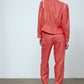 The Emma Pants in Orange Linen. The pants feature cargo details on the side and large pockets with piping details in a contrasting color. Easily modify the shape of the pants with a button adjustment.  Style them with a t-shirt, blouse, or a matching Emma Jacket in Orange Linen.   Also available in Pink and Navy.