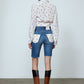 The Layla Denim Shorts has a slim fit, cut off above the knees and Daisy Flower Silk applications on the back pockets.