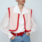 The Ravnbak Vest in Baby Pink with a red lining. Style it over a shirt, dress or top.  Also available in Beaded Olive Green.  Material: 70% viscose, 30% tencel. Lining: 100% viscose.