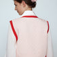 The Ravnbak Vest in Baby Pink with a red lining. Style it over a shirt, dress or top.  Also available in Beaded Olive Green.  Material: 70% viscose, 30% tencel. Lining: 100% viscose.