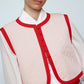 The Ravnbak Vest in Baby Pink with a red lining. Style it over a shirt, dress or top.  Also available in Beaded Olive Green.  Material: 70% viscose, 30% tencel. Lining: 100% viscose.