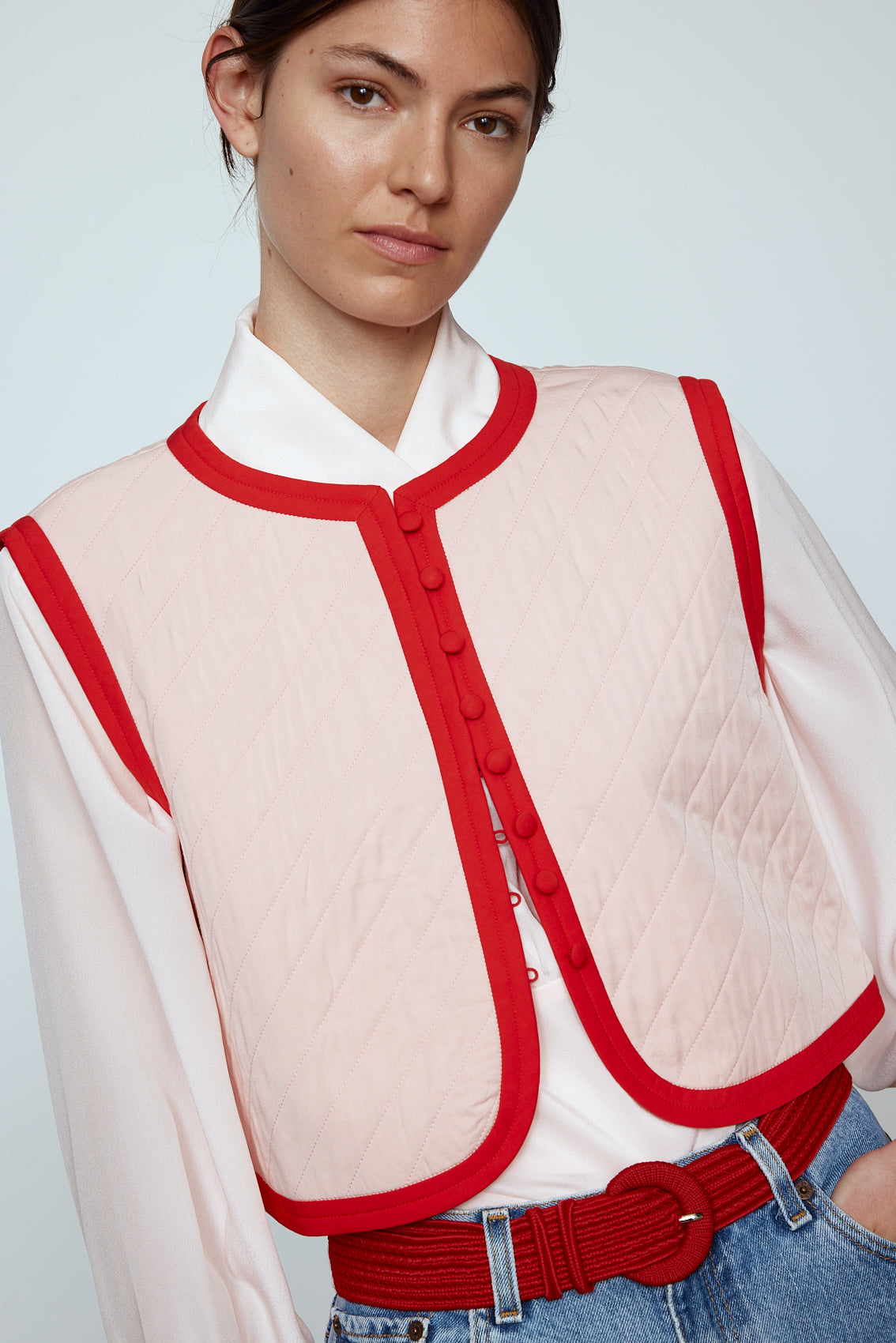 The Ravnbak Vest in Baby Pink with a red lining. Style it over a shirt, dress or top.  Also available in Beaded Olive Green.  Material: 70% viscose, 30% tencel. Lining: 100% viscose.