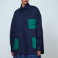 The Frederik Shirt is an oversized cotton style with big sleeves, green pockets, and an embroidered Caro logo on the front.  Style it open over a dress, tank top, or t-shirt or buttoned up on its own.  Material: 100% cotton.  The model is 179cm (5'10") and wears size S. Frederik Bille Brahe.