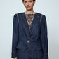 The Emma Jacket in Navy Linen. A new flattering jacket shape inspired by Caroline's favorite vintage 70's finds. The Jacket features a single-button closing, balloon sleeves, and contrasting color piping details around the edges.   Also available in Pink/Green and Orange/Pink.