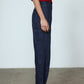 The Emma Pants in Navy Linen. The pants feature cargo details on the side and large pockets with piping details in a contrasting color. Easily modify the shape of the pants with a button adjustment.  Style them with a t-shirt, blouse, or a matching Emma Jacket in Navy Linen.   Also available in Pink and Orange.  Material: 100% linen. Lining: 100% viscose.