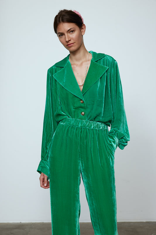 The Bonsai Shirt is made in a luxurious silk velvet fabric with a heavy fall and a deep emerald green color. The Shirt features long draped sleeves, a deep-cut oversized shirt collar, and buttons on the front.   Style it with jeans and a colorful belt, or match it with the Elisabeth Pants in emerald green Silk Velvet for parties, dinners, and special occasions.    Material: 20% silk, 80% viscose.  The model is 179cm (5'10") and wears size S.