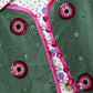 The Ravnbak Vest in Olive Green velvet with a pink lining. The vest is exquisitely hand-embroidered by skilled artisans in our flower daisy pattern using beadings and sequins. Style it over a shirt, dress, or top.  Also available in Baby Pink.