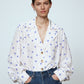 The Bonsai Shirt is made in soft silk fabric featuring our White Daisy print. The Shirt has long draped sleeves, a deep-cut oversized shirt collar, and buttons on the front.   Style it with jeans and a colorful belt, together with a vest or denim jacket.   Material: 100% mulberry silk.  The model is 179cm (5'10") and wears size S.