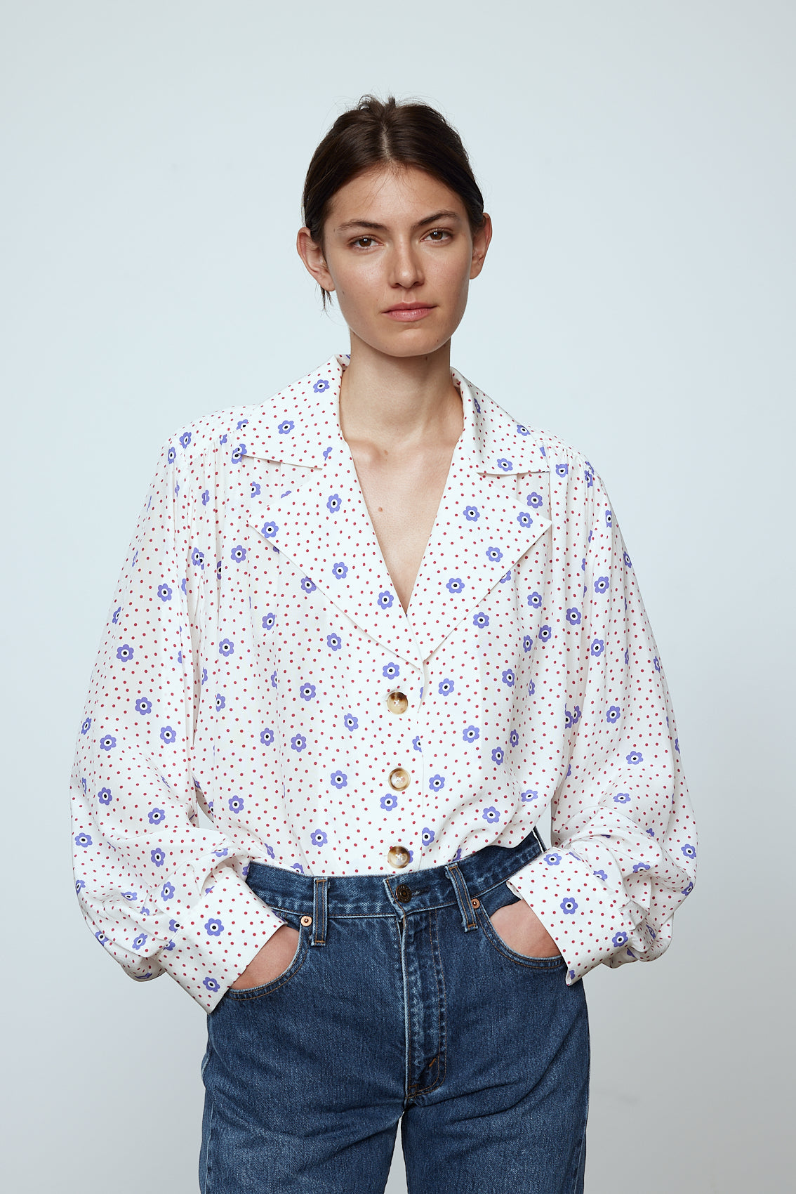 The Bonsai Shirt is made in soft silk fabric featuring our White Daisy print. The Shirt has long draped sleeves, a deep-cut oversized shirt collar, and buttons on the front.   Style it with jeans and a colorful belt, together with a vest or denim jacket.   Material: 100% mulberry silk.  The model is 179cm (5'10") and wears size S.