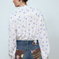 The Bonsai Shirt is made in soft silk fabric featuring our White Daisy print. The Shirt has long draped sleeves, a deep-cut oversized shirt collar, and buttons on the front.   Style it with jeans and a colorful belt, together with a vest or denim jacket.   Material: 100% mulberry silk.  The model is 179cm (5'10") and wears size S.