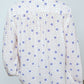 The Bonsai Shirt is made in soft silk fabric featuring our White Daisy print. The Shirt has long draped sleeves, a deep-cut oversized shirt collar, and buttons on the front.   Style it with jeans and a colorful belt, together with a vest or denim jacket.   Material: 100% mulberry silk.  The model is 179cm (5'10") and wears size S.