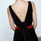 The Sonya Dress is an oversized style with a high neckline and deep back with large bow detail. The dress is made of luxuriously heavy black silk velvet.   Style it with a belt or on its own.  Material: 20% silk, 80% viscose.  The model is 179cm (5'10") and wears size S.