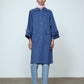 The Anna Coat in French Blue Canvas. The jacket is inspired by vintage work-wear with wide sleeves, cuffs, and button closing on the front.  Material: 100% cotton.