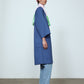The Anna Coat in French Blue Canvas. The jacket is inspired by vintage work-wear with wide sleeves, cuffs, and button closing on the front.  Material: 100% cotton.