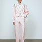The Emma Jacket in Baby Pink Linen. A new flattering jacket shape inspired by Caroline's favorite vintage 70's finds. The Jacket features a single-button closing, balloon sleeves, and contrasting color piping details around the edges.   Also available in Navy and Orange/Pink.