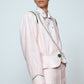 The Emma Jacket in Baby Pink Linen. A new flattering jacket shape inspired by Caroline's favorite vintage 70's finds. The Jacket features a single-button closing, balloon sleeves, and contrasting color piping details around the edges.   Also available in Navy and Orange/Pink.