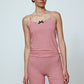 Caro Editions' new signature line in jersey cotton.  The Caro Tank is a fitted style with a ribbon bow detail at the front and embroidered Caro Editions logo on the back.   Also available in White, Pink White stripe, and Black White stripe.  Style the Caro Tank under shirts or dresses, or wear them on their own.  Material: 95% cotton, 5% elastane. Bow: 100% Polyester.  The model is 179cm (5'10") and wears size S.