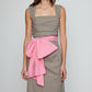 Caro Editions Sophie Dress is a classic dress with a big detachable bow detail on the side. The Dress features wide straps, a slit, and a fitted waist. The dress is made in lightweight cotton poplin. Both the bow and the belt in pink can is detachable.