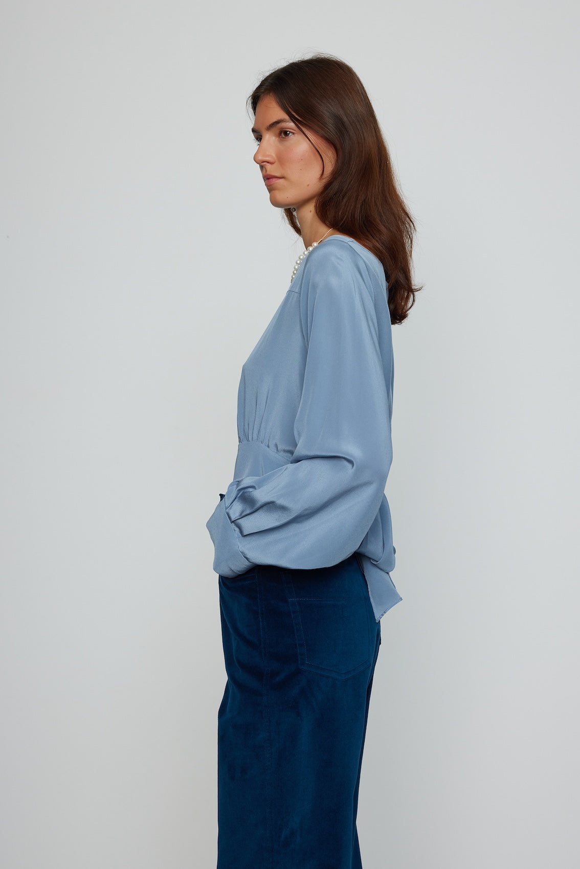 Caro Editions Olga Shirt features a straight neckline and our signature long draped sleeves made from soft crepe de chine silk. This shirt has a large bow at the back, which can be adjusted to fit perfectly around the waist. Material: 100% Silk.