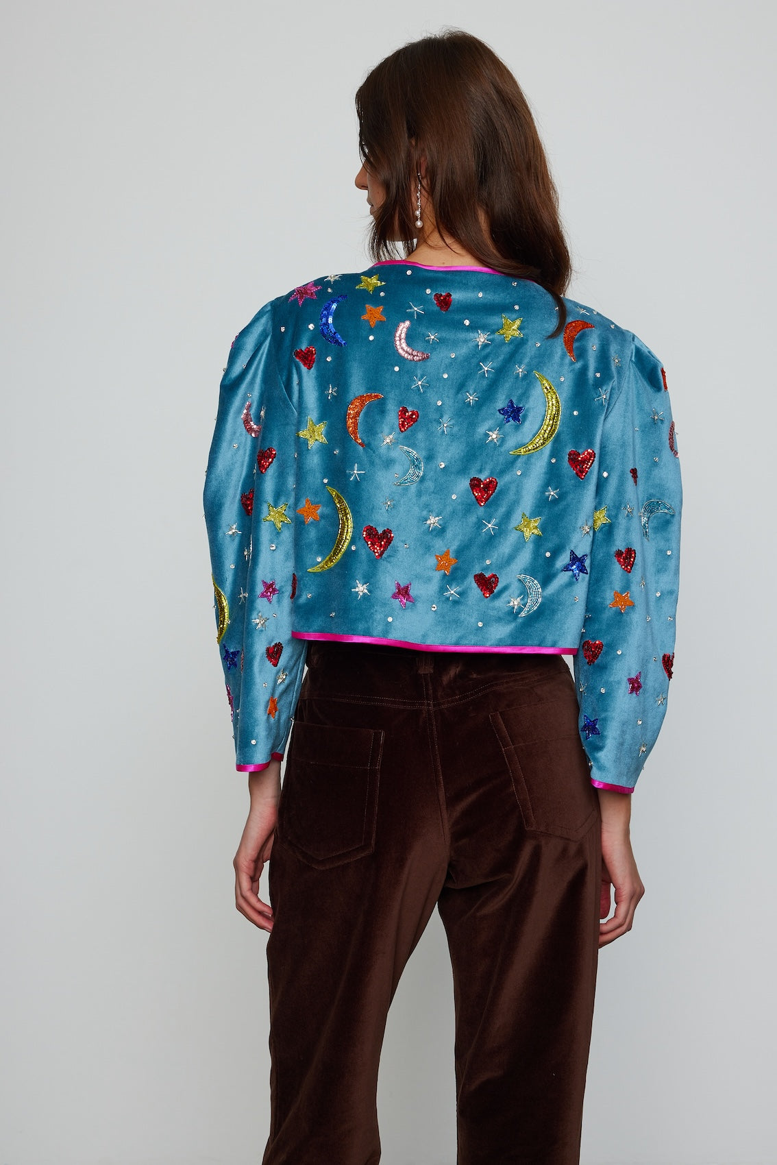 Caro Editions Blanca Jackets is one-of-kind, exquisitely hand-embroidered by skilled artisans using beads and sequins. This vibrant jacket is made in soft cotton velvet with silk lining and petit silk-covered buttons.  Material: 100% cotton. Lining: 100% silk satin. Beading: polyester & glass.