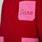 Caro Editions Frederik Shirt is an oversized cotton corduroy style with big sleeves, pink pockets, and an embroidered Caro logo. Style it open over a dress, tank top, or t-shirt, or wear it buttoned-up.