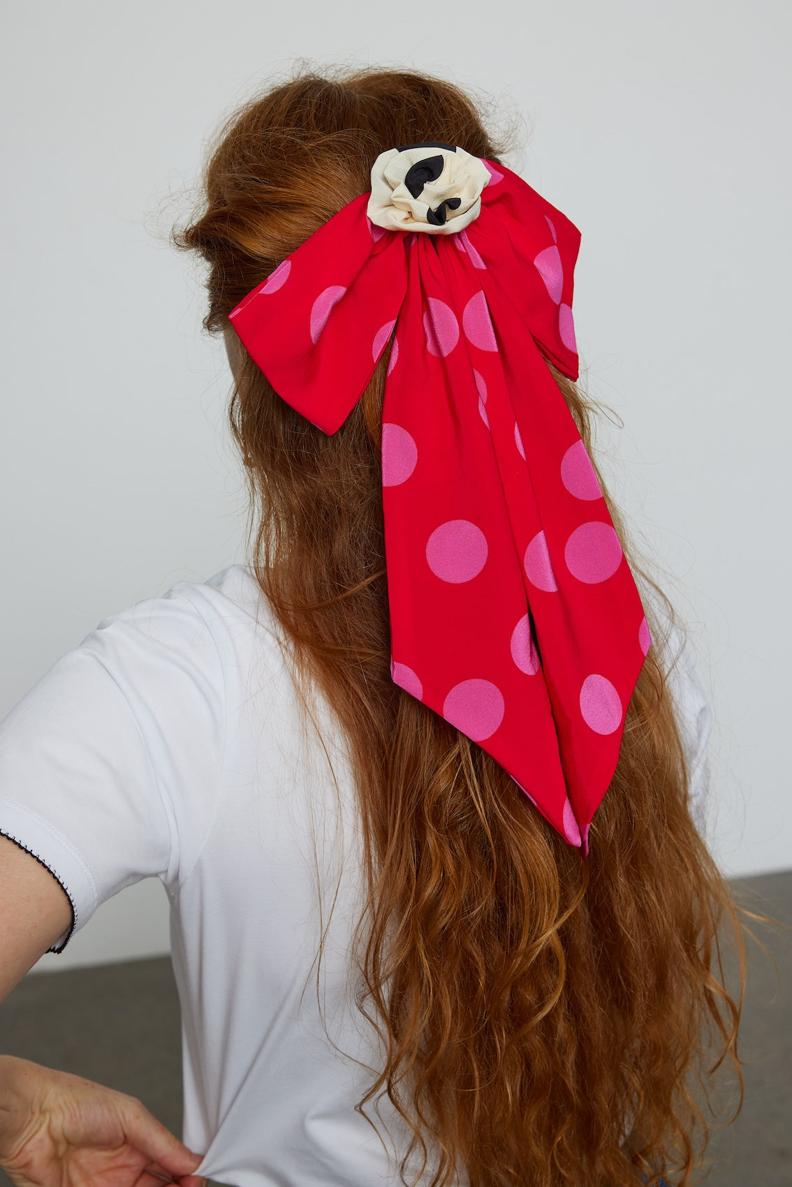 Caro Editions Caro Hair Bow in printed crepe de chine fabric featuring large polka dots. This is a statement hair accessory that elevates any outfit.
