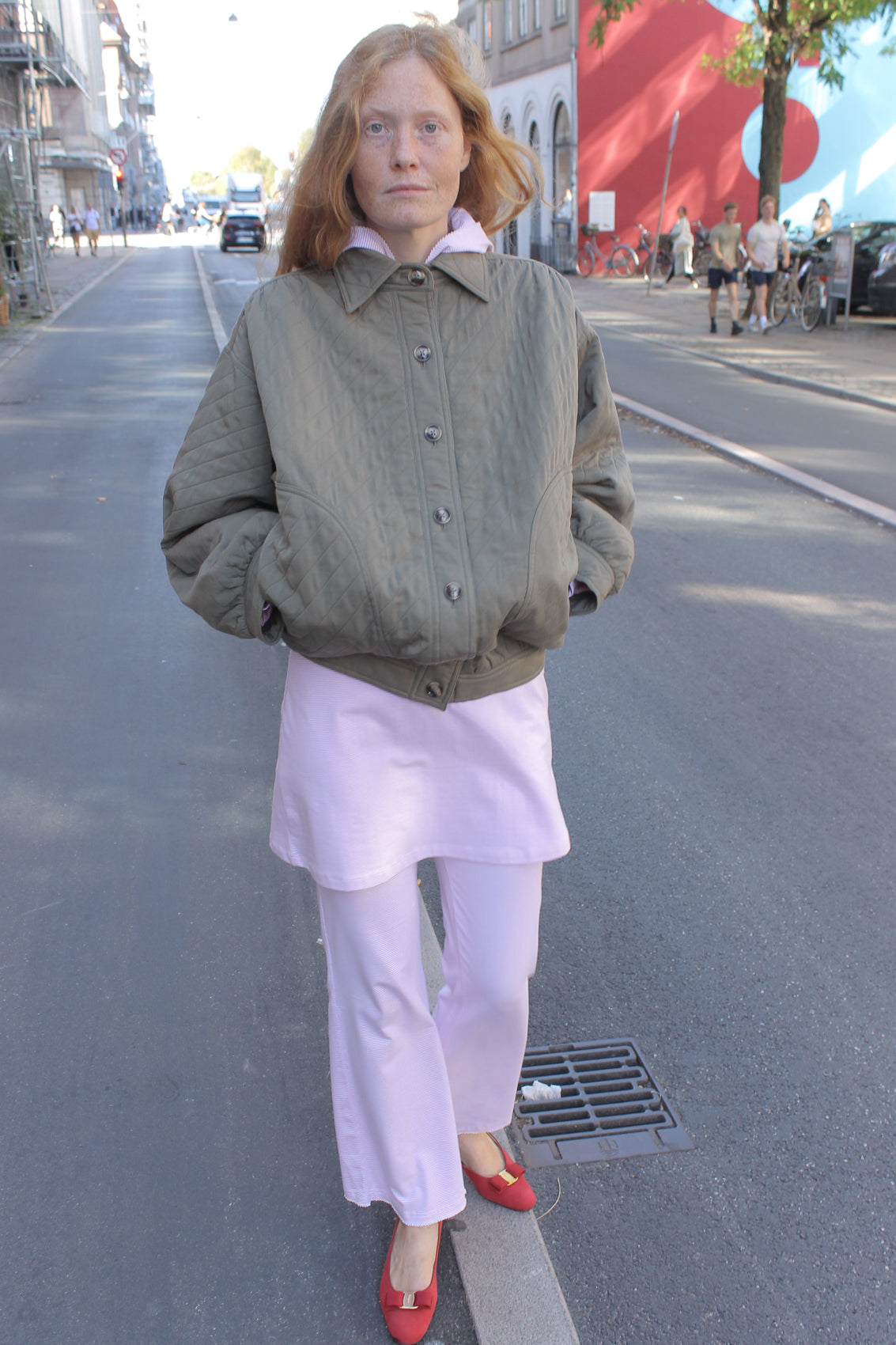 The Mimi Jacket in Khaki padded twill. A rounded shape inspired by the 80s in quilted fabric with big round buttons.  Style it over dresses, jeans, or leggings. 