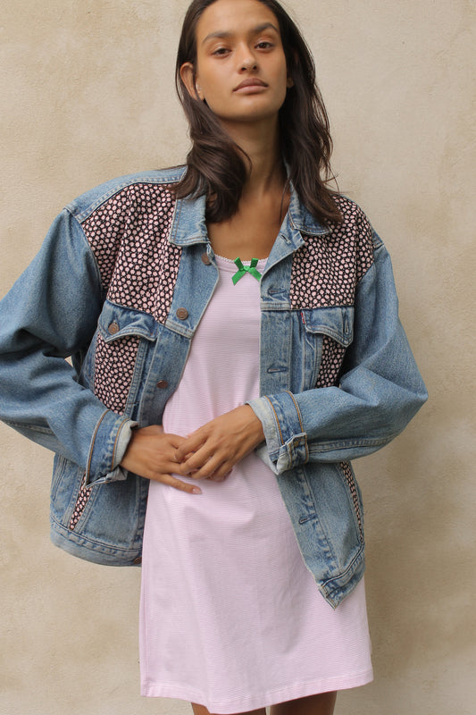 Upcycled vintage denim jacket redesigned with patchwork in exclusive Dries Van Noten vintage fabric with a green floral print. One-of-a-kind.  Size: S/M
