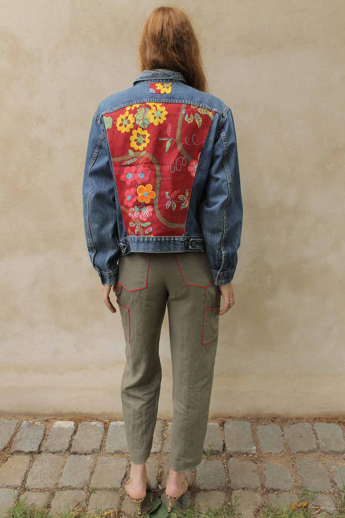 Upcycled vintage denim jacket redesigned with patchwork in exclusive Josef Frank vintage fabric with a green floral print. One-of-a-kind.  Size: S/M
