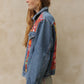 Upcycled vintage denim jacket redesigned with patchwork in exclusive Josef Frank vintage fabric with a green floral print. One-of-a-kind.  Size: S/M