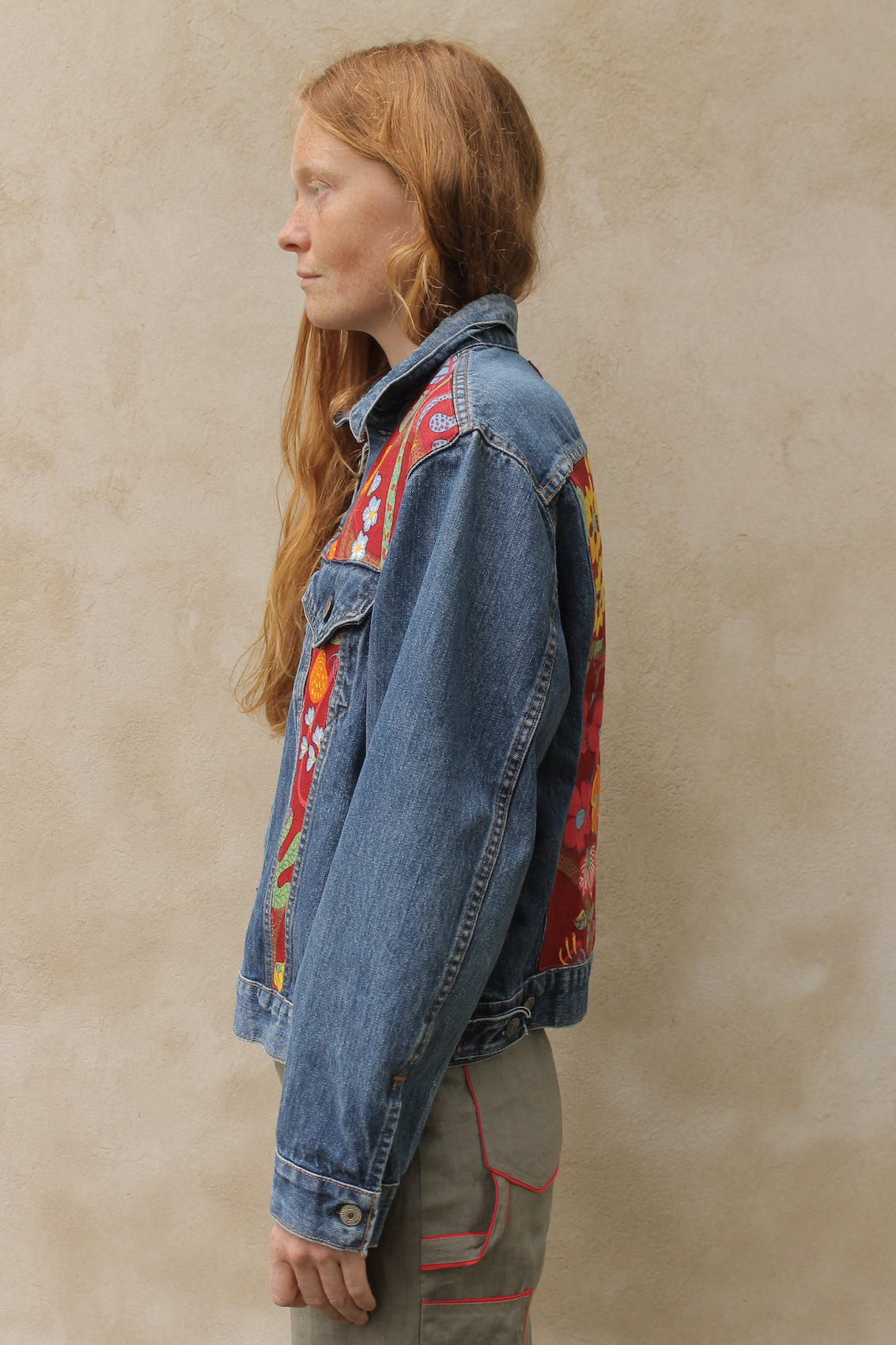 Upcycled vintage denim jacket redesigned with patchwork in exclusive Josef Frank vintage fabric with a green floral print. One-of-a-kind.  Size: S/M