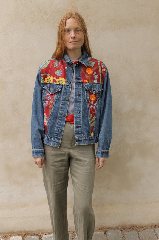 Upcycled vintage denim jacket redesigned with patchwork in exclusive Josef Frank vintage fabric with a green floral print. One-of-a-kind.  Size: S/M