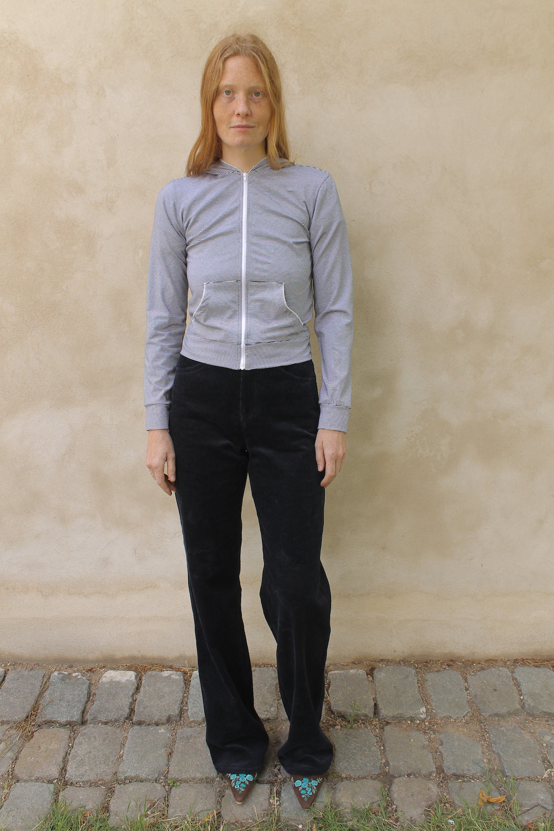 Caro Editions' new signature line in jersey cotton.  The Caro PJ Hoodie is a slightly fitted style with long sleeves, a zipper opening on the front, and embroidered Caro Editions logo on the back.   Also available in Red White stripe.  Style the Caro PJ Hoodie under a jacket or shirt, with matching Caro PJ Leggings, jeans, or a skirt.  Material: 95% cotton, 5% elastane. Bow: 100% Polyester.  The model is 179cm (5'10") and is wearing a size S.
