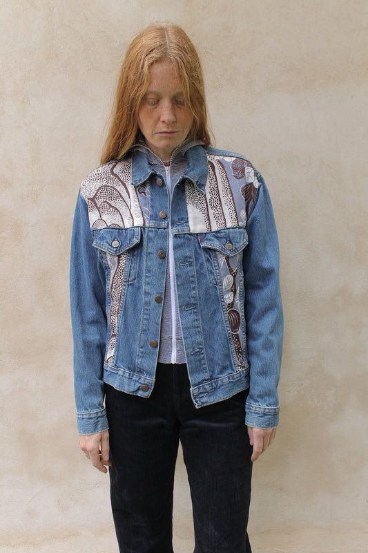 Upcycled vintage denim jacket redesigned with patchwork in exclusive Josef Frank vintage fabric with a green floral print. One-of-a-kind.  Size: S/M