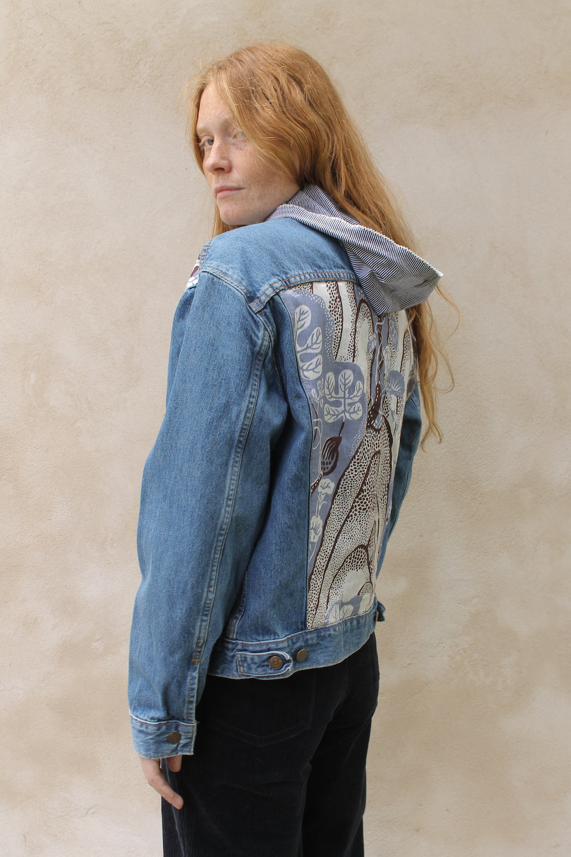Upcycled vintage denim jacket redesigned with patchwork in exclusive Josef Frank vintage fabric with a green floral print. One-of-a-kind.  Size: S/M