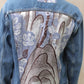 Upcycled vintage denim jacket redesigned with patchwork in exclusive Josef Frank vintage fabric with a green floral print. One-of-a-kind.  Size: S/M