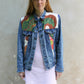 Upcycled vintage denim jacket redesigned with patchwork in exclusive Josef Frank vintage fabric with a green floral print. One-of-a-kind.  Size: S/M