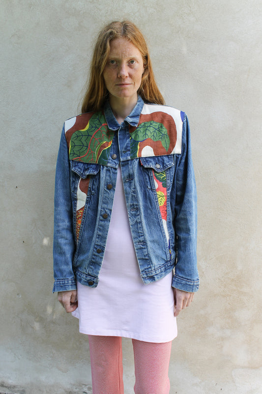 Upcycled vintage denim jacket redesigned with patchwork in exclusive Josef Frank vintage fabric with a green floral print. One-of-a-kind.  Size: S/M