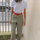 The Emma Pants in Khaki Linen. The pants feature cargo details on the side and large pockets with piping details in a contrasting color. Easily modify the shape of the pants with a button adjustment.  Style them with a t-shirt, blouse, or a matching Emma Jacket in Khaki.  Also available in Orange, Pink and Navy.  Material: 100% linen. Lining: 100% viscose.  The model is 175cm (5'9") and is wearing a size S.