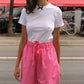 The Hannah shorts are loose-fitted poplin-style shorts with an elastic band, pockets, and cargo details.  Style it with a matching Hannah Shirt or a T-shirt.  Also available in Navy Flower Poplin, White Flower Poplin and Khaki.  Material: 100% cotton.  The model is 175cm (5'9") and is wearing a size S.
